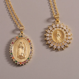 Golden Virgin Mary necklaces with colorful gems and zircon on grey background