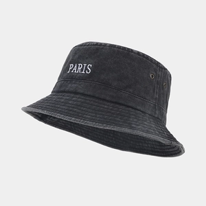 Washed black cotton bucket hat with white PARIS embroidery and metal ventilation eyelets
