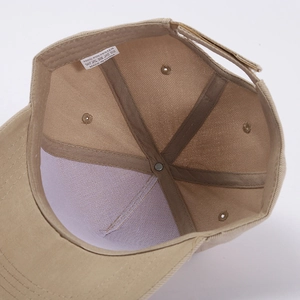Interior details of khaki polyester baseball cap with stitching and adjustable strap