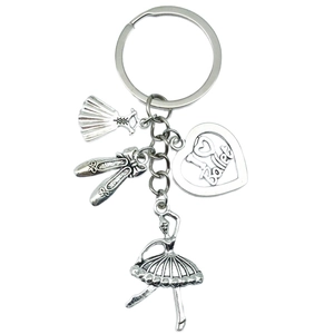 Elegant silver ballet keychain featuring a tutu, ballet shoes, and heart pendant