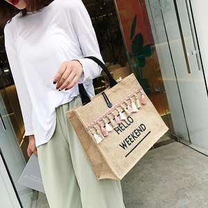 Minimalist jute tote bag with Hello Weekend print and colorful tassel accessory