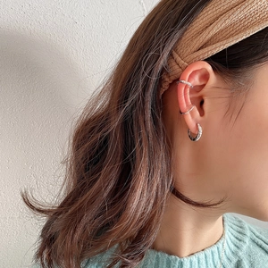 Minimalist S925 sterling silver hoop earrings and textured ear cuffs on a model