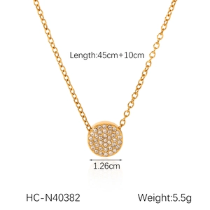 Detail showing 18K gold stainless steel necklace with sparkling circular rhinestone pendant