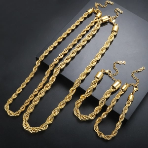 Detailed macro view of 18K gold-plated stainless steel twist rope chain necklace and bracelet