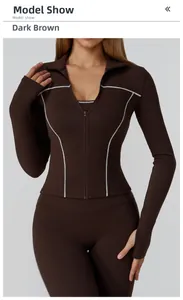 Detail view of deep brown zip-up yoga jacket with white contrast stitching and slim fit