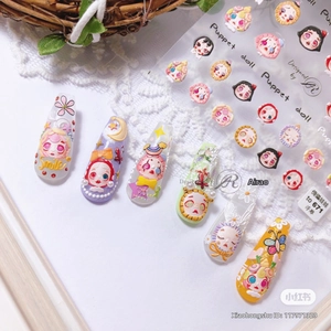 Detailed 5D embossed nail art stickers featuring cute doll heads on colorful long nails