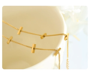 Detailed close-up of a 18K gold plated stainless steel bamboo link chain bracelet
