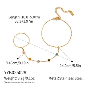 Detailed view of stainless steel finger bracelet with multi-color zircon stones in gold finish
