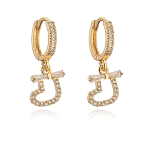 Elegant gold-plated bow heart earrings with sparkling cubic zirconia on white background
