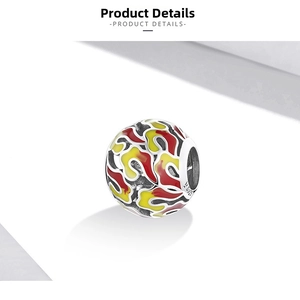Detail view of S925 sterling silver bead with red and yellow enamel flame patterns