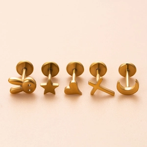 Gold stainless steel cartilage stud set featuring heart, star, and moon shapes