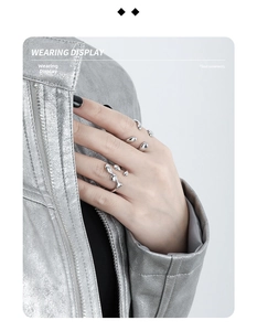 Close-up of minimalist liquid metal style S925 sterling silver rings on a model