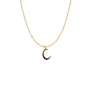 Detail of a golden O-chain necklace with a black crescent moon pendant on white background