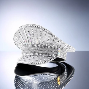 Macro detail of silver sequined military hat with metallic spikes and colorful gems