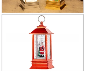 Macro shot of red Christmas lantern featuring Santa Claus and glittery snow interior