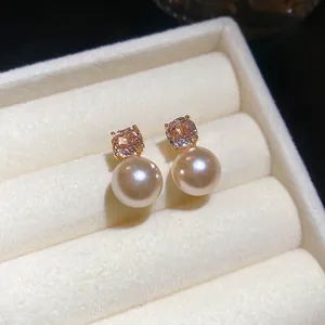 Elegant gold-plated pearl earrings with pink zircon stone set in a luxury velvet box