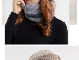 Detail eines grauen Winter-Strickschals mit dicker Textur und warmem Fleece-Futter