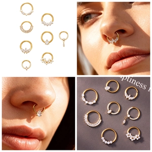 Detail of gold titanium nose ring set with 5A cubic zirconia stones on model and flat lay