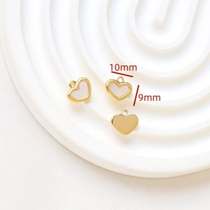 Detailed macro view of 10mm gold-plated heart pendant with mother of pearl inlay