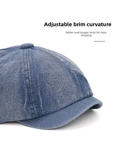 Detail of blue denim octagonal cap with adjustable wide brim for face contouring