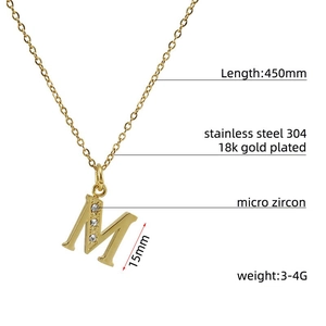 Detail of 18k gold plated letter M pendant with micro zircon on a 450mm chain
