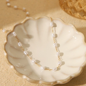 French vintage 18K gold plated stainless steel pearl necklace in a shell dish