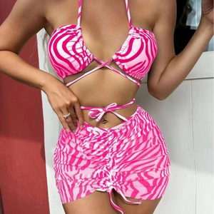 Three-piece pink zebra print bikini set with halter top and drawstring mini skirt