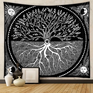 Detail of tree of life tapestry showing mystical moon and sun patterns on white wall