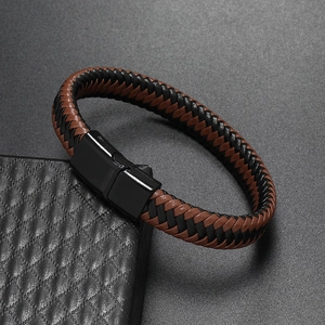 Detail of woven brown and black leather strap with black magnetic metal clasp