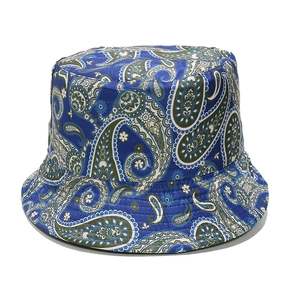 Detailed view of blue paisley print on textured cotton fabric of the bucket sun hat