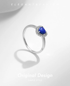 Detailed close-up of S925 sterling silver ring featuring a blue oval opal stone setting