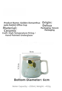 Detail view of hand-painted rabbit and osmanthus motifs on a white ceramic mug