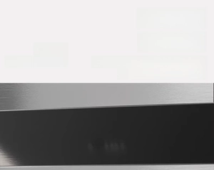 Close-up of magnetic kitchen timer with brushed metal texture for fridge attachment