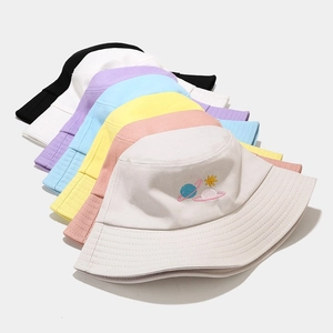 Multi-color cotton bucket hats with planet embroidery shown in an organized tiered layout