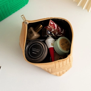 Top view of beige corduroy makeup bag showing large capacity for cosmetics storage