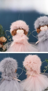 Detailed view of plush Christmas angel ornaments with tulle skirts and sparkling wings