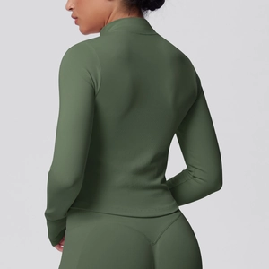 Detail of olive green ribbed back fabric on seamless yoga jacket for breathability