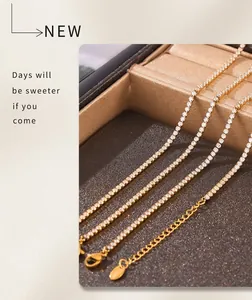 Close-up of gold plated tennis chains with sparkling cubic zirconia and lobster clasp