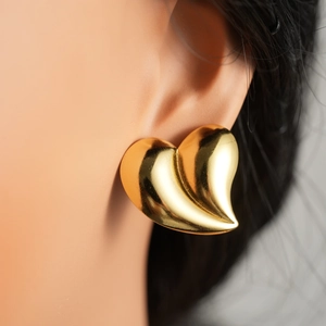 Elegant gold-tone minimalist heart-shaped hollow stainless steel stud earrings on model