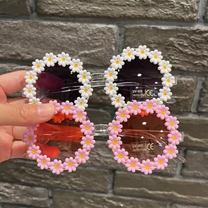 Daisy flower children's sunglasses with UV400 protection in white and pink shades