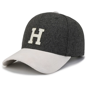 Detail of wool blend baseball cap with H patch, grey and cream bicolor textured finish