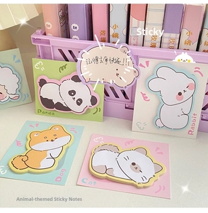 Close-up of cute cartoon animal sticky notes including panda and rabbit shapes