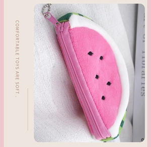 Detailed view of pink watermelon plush coin purse with zipper and metal bead chain
