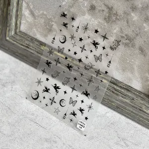 Close-up of 5D embossed nail stickers featuring celestial stars and winged horse designs
