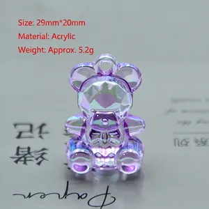 Macro detail of purple iridescent acrylic bear charm with 29x20mm dimension markings