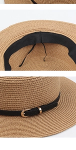 Detail of adjustable inner sweatband and black leather strap on straw sun hat