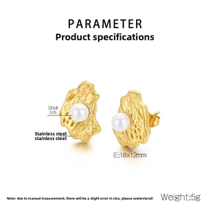 Detail of gold irregular textured stainless steel earrings with white shell pearls