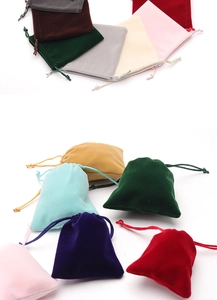Various colored velvet drawstring jewelry pouches for storage and gift packaging