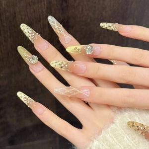 Luxury long stiletto press-on nails with pink cat-eye base and gold glitter diamond accents