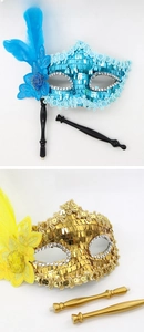 Detail of sequin masks with removable handheld sticks for masquerade and Halloween